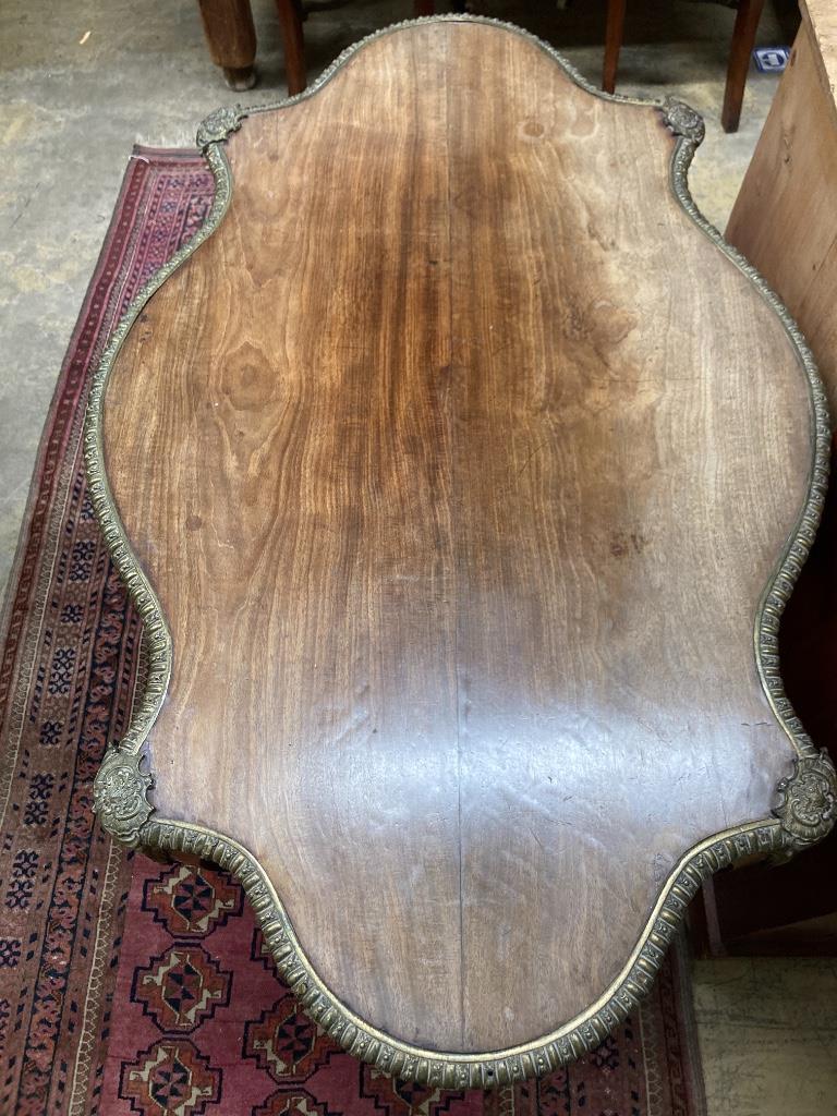A 19th century French marquetry and kingwood centre table, (having later walnut-veneered top) width 124cm, depth 78cm, height 74cm